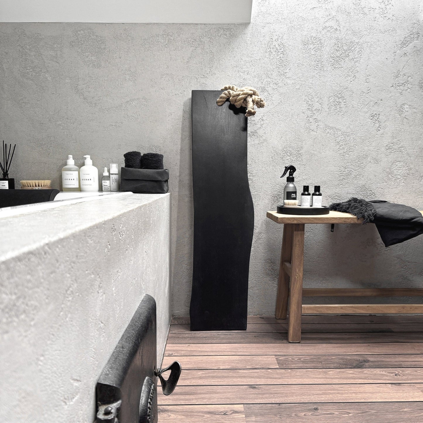 Black live-edge ash bath caddy, jute rope, wall-leaning spa-ready tray