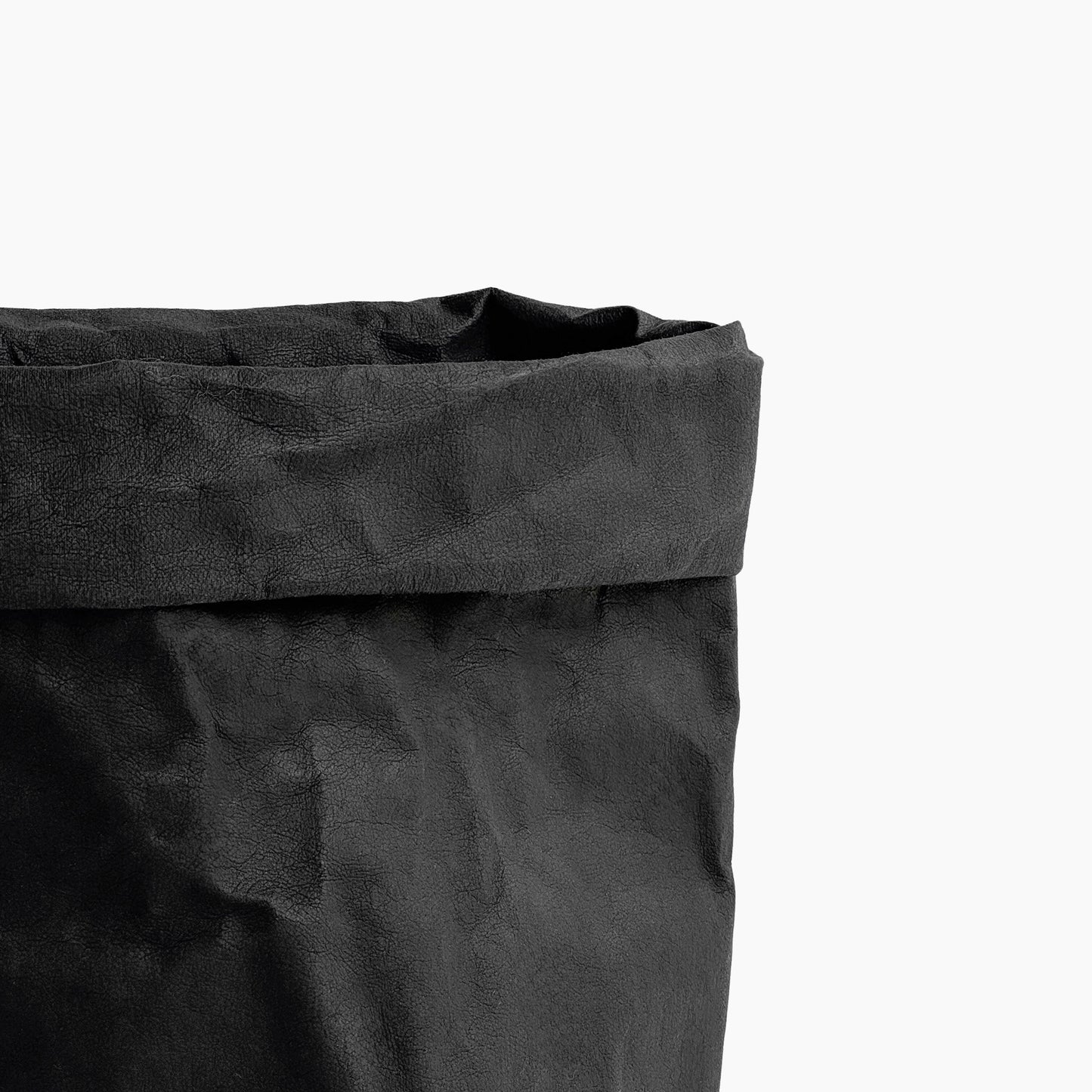 Close-up of a black washable paper bag on a white background