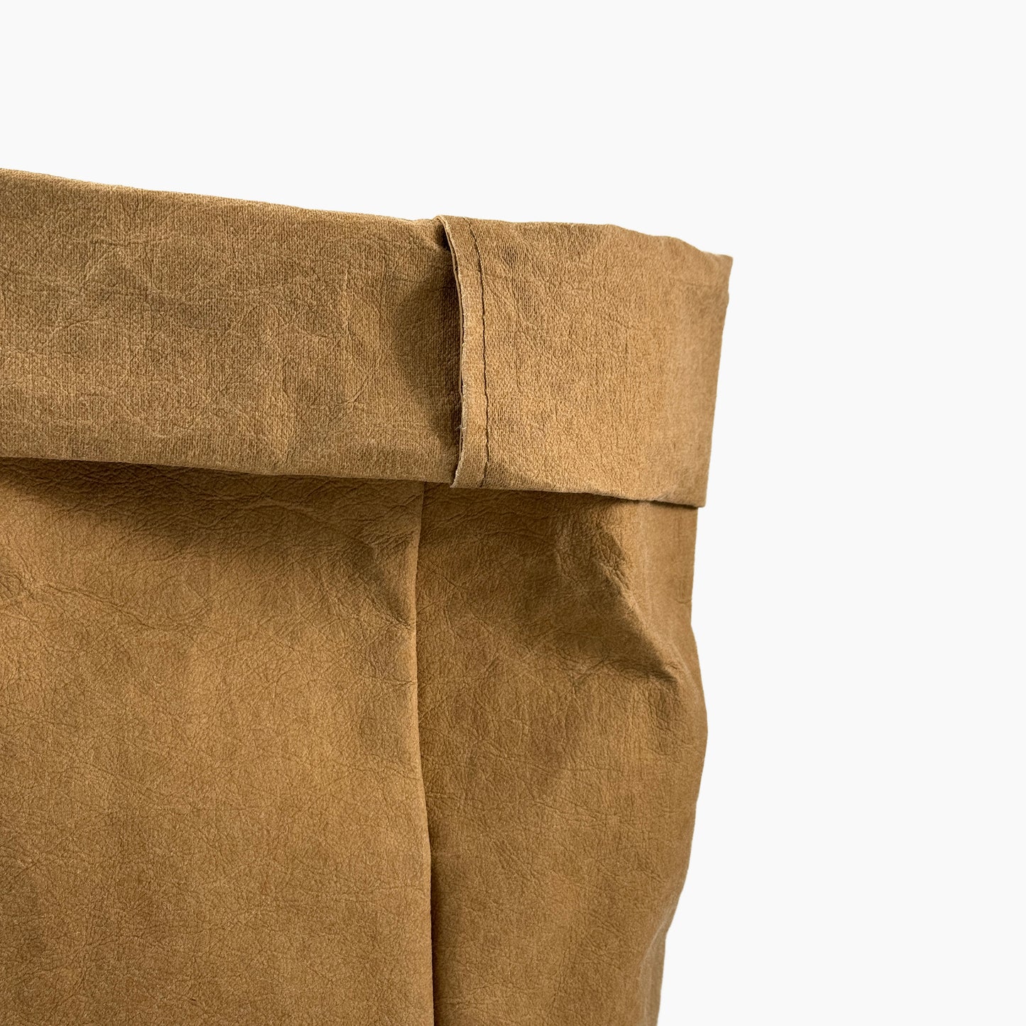 Close-up of a brown washable paper bag on a white background