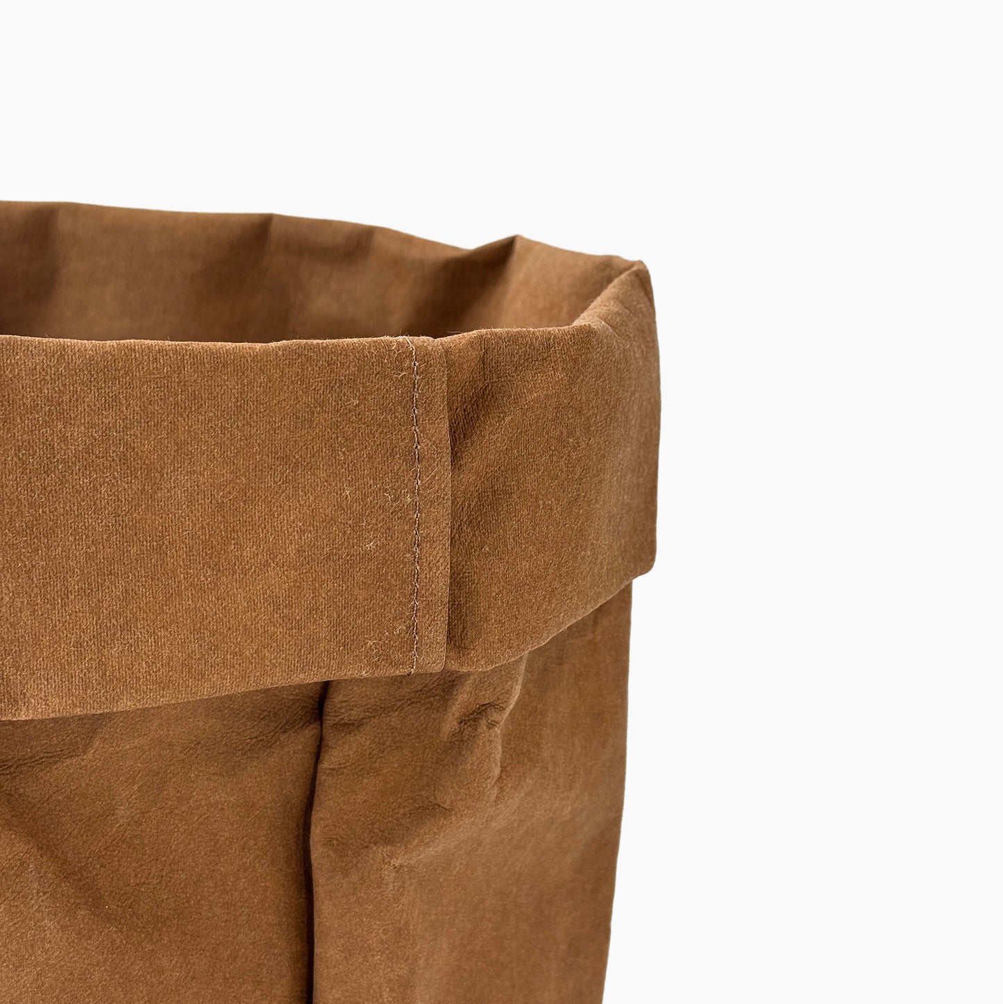 Close-up of a cinnamon washable paper bag on a white background