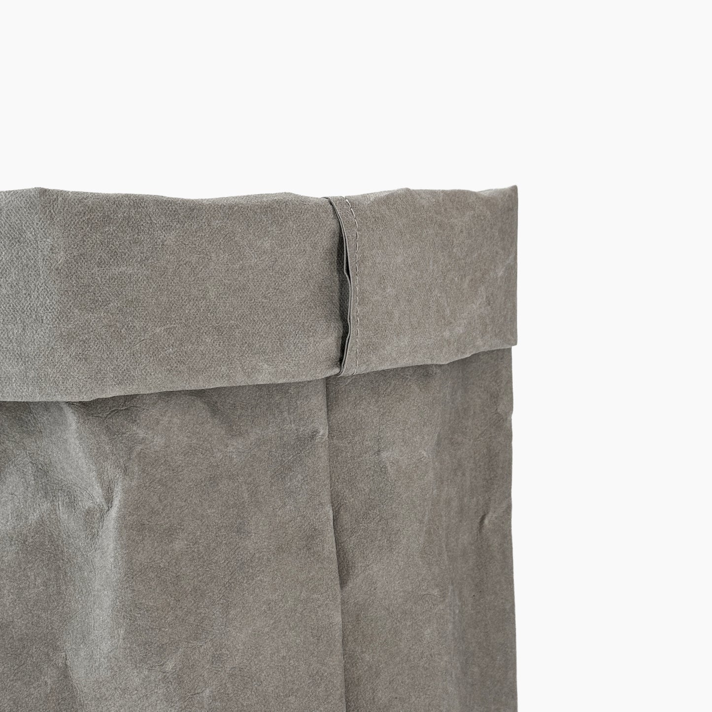 Close-up of a gray washable paper bag with a white background