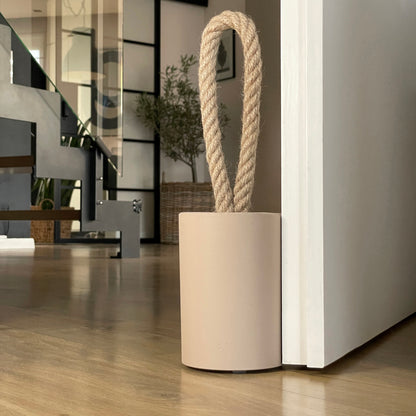 Compact concrete door stop for lighter doors and windows