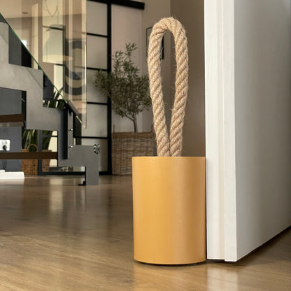 Compact concrete door stop for modern interior setting
