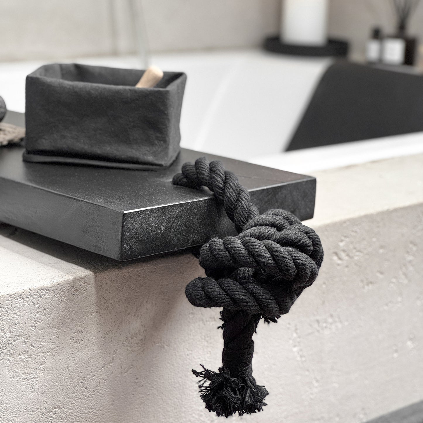 Close-up black live-edge bath caddy, black cotton rope, spa-ready tray detail