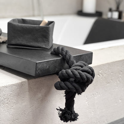 Close-up black live-edge bath caddy, black cotton rope, spa-ready tray detail