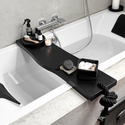 Black live-edge wood bath caddy, black cotton rope rope, top side view spa tray holding tub-side essentials
