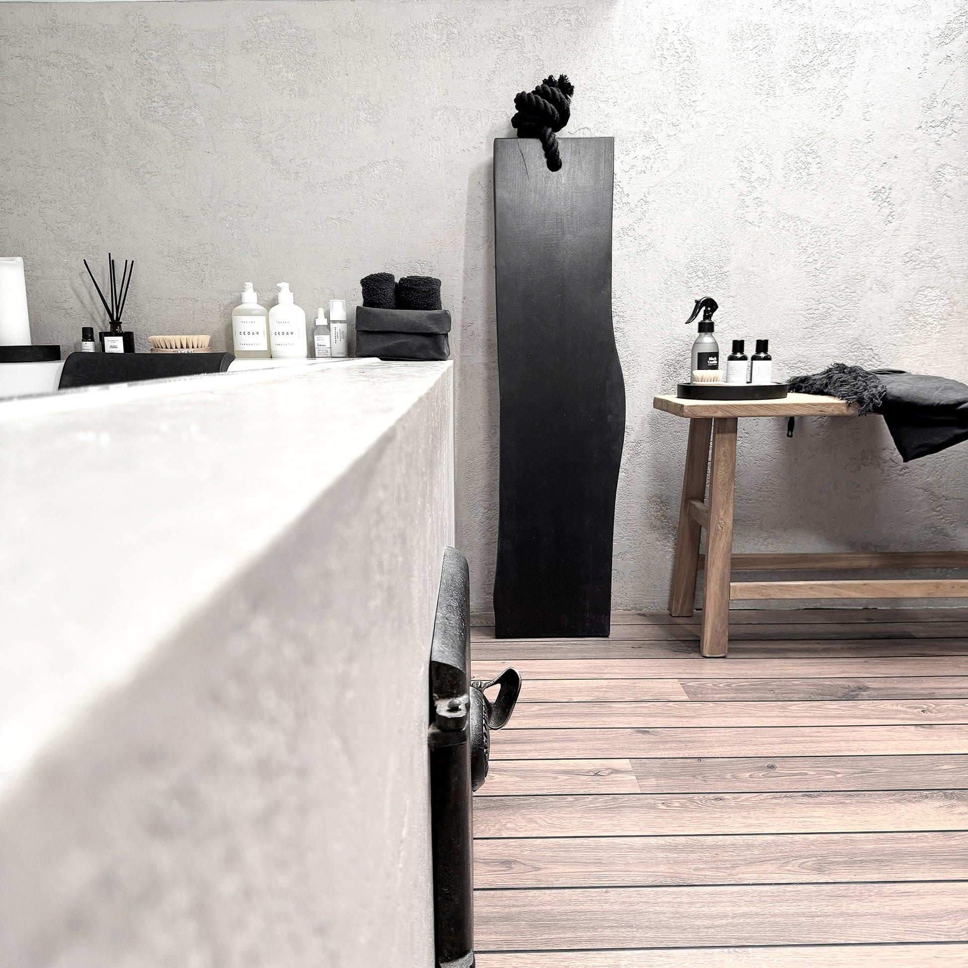 Black live-edge ash bath caddy, black cotton rope, wall-leaning spa-ready tray