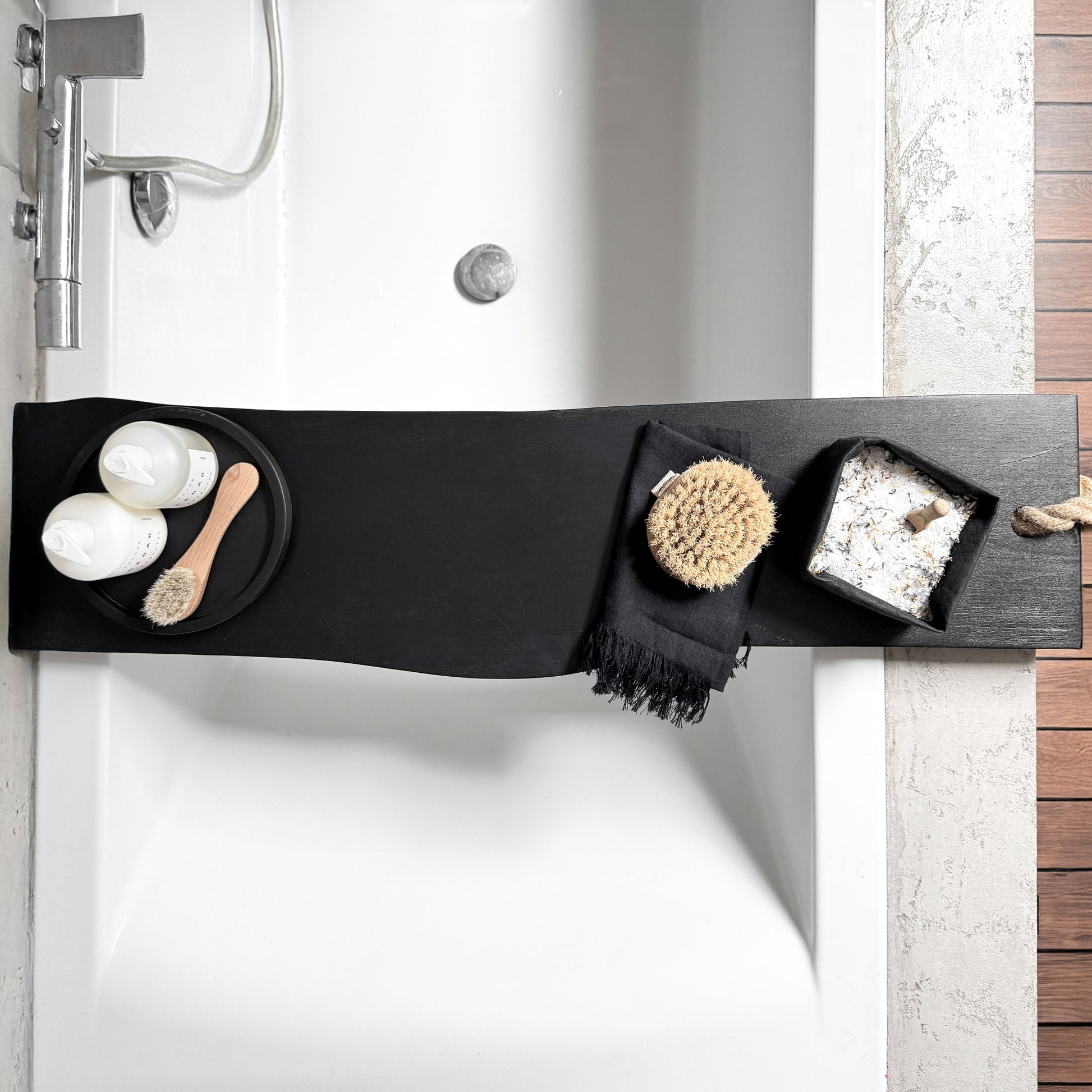 Black live-edge wood bath caddy, jute rope, top view spa tray holding tub-side essentials