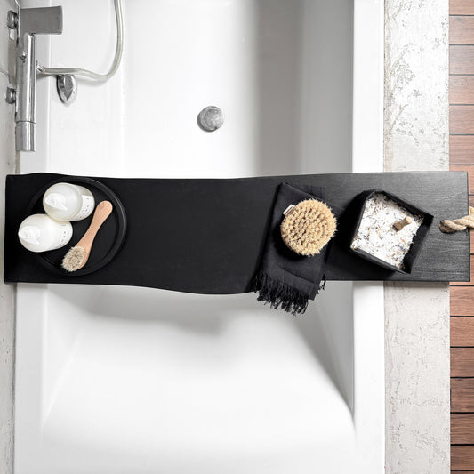 Top view modern bathroom bath board resting across bathtub