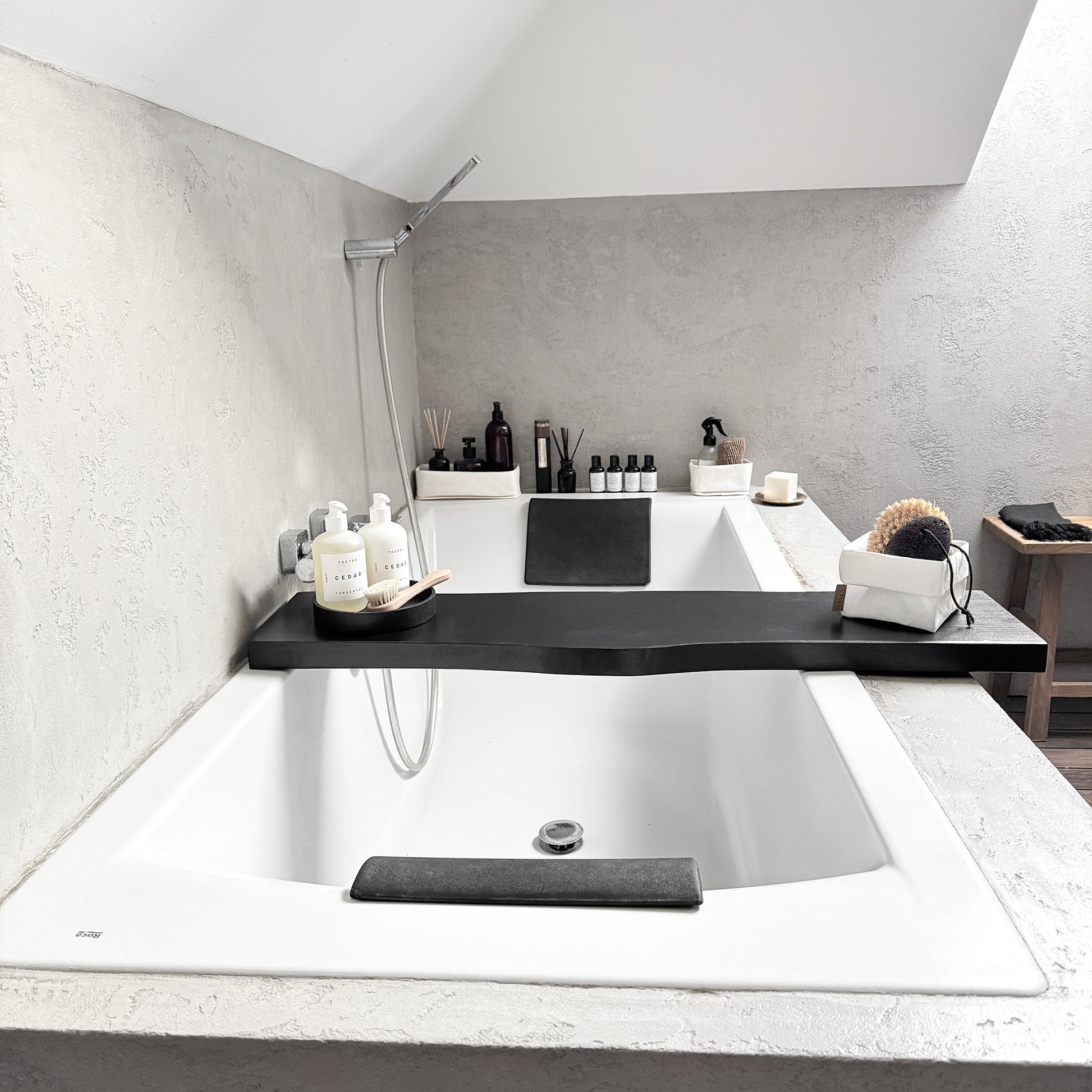 Black live-edge bath caddy, front-view spa tray cradling tub-side essentials