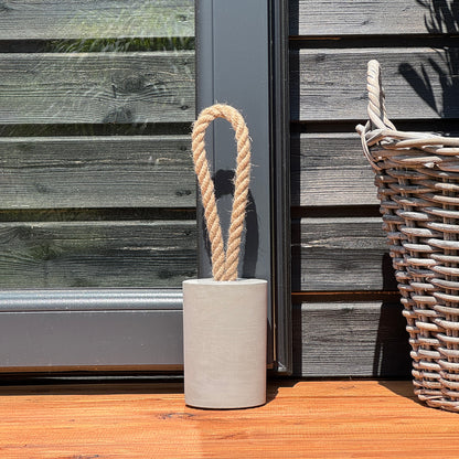 Loop concrete door stop with natural jute handle used outdoor