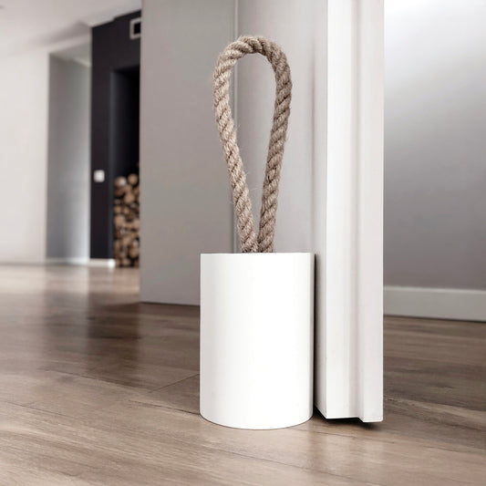 Compact concrete door stop with jute rope handle