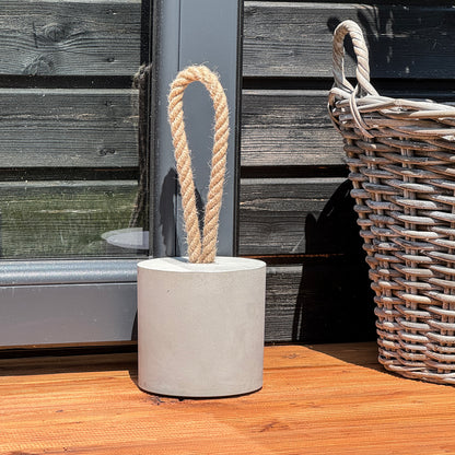 Concrete door stop XL loop design with jute rope handle used outdoor
