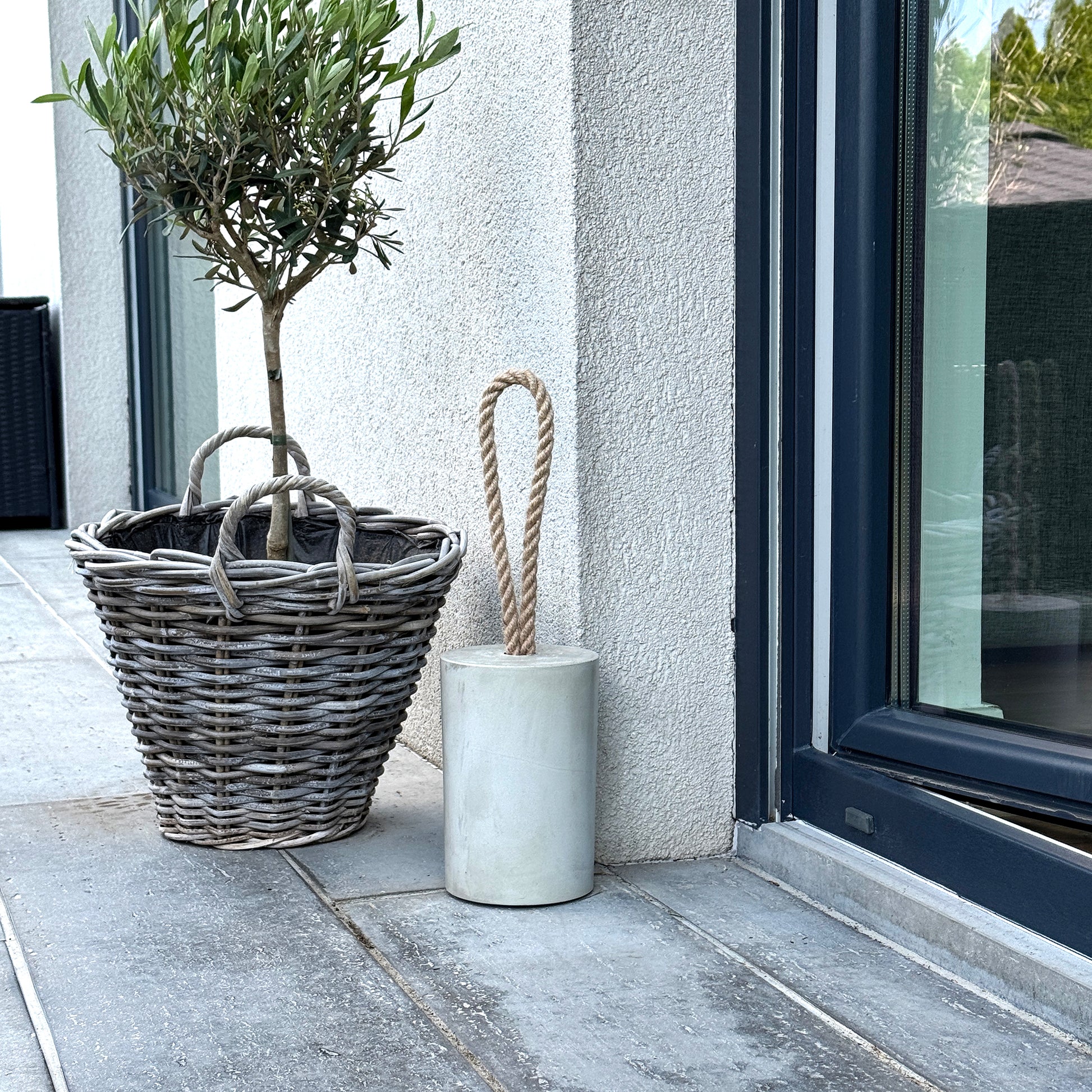 Concrete door stop with jute rope handle outdoor covered use