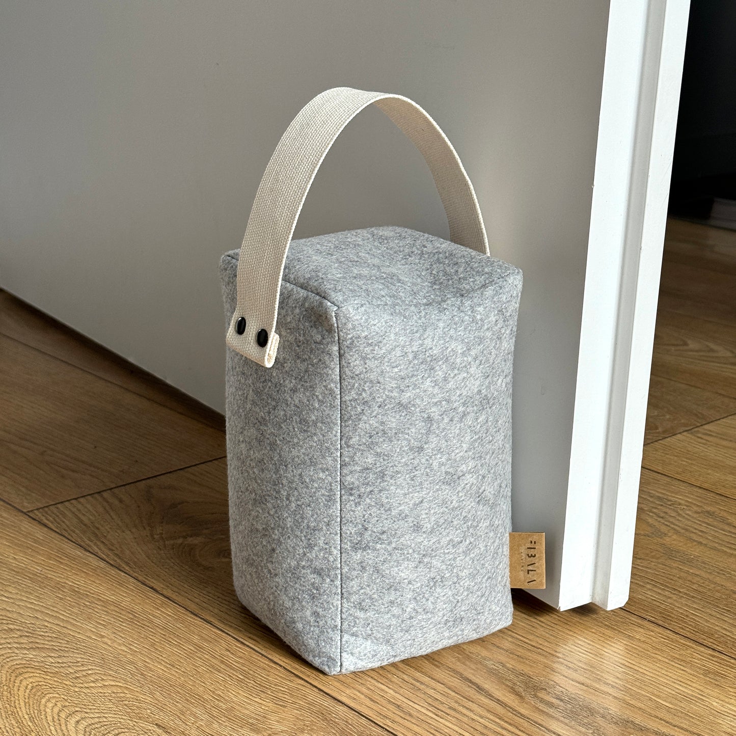 LUND wool door stop with cotton handle in neutral tone for modern interiors