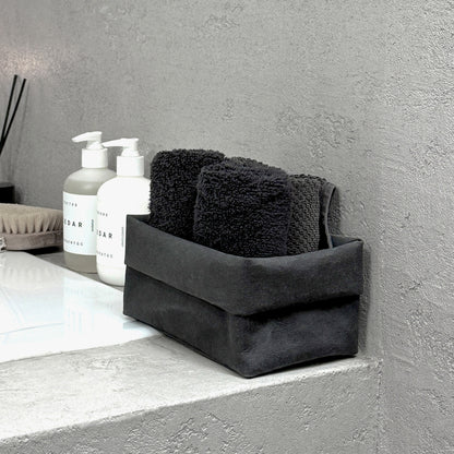 Side-view medium black washable paper box + towels, bath edge—eco storage organizer