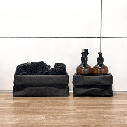 Front-view black washable paper boxes, soap & spray + towels, laundry counter—eco storage set