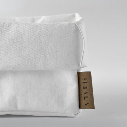 Close-up small white washable paper box texture, white BG—eco storage detail