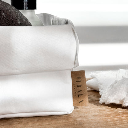 Close-up small white washable paper box, Fibala Living label, toiletries—eco bath storage