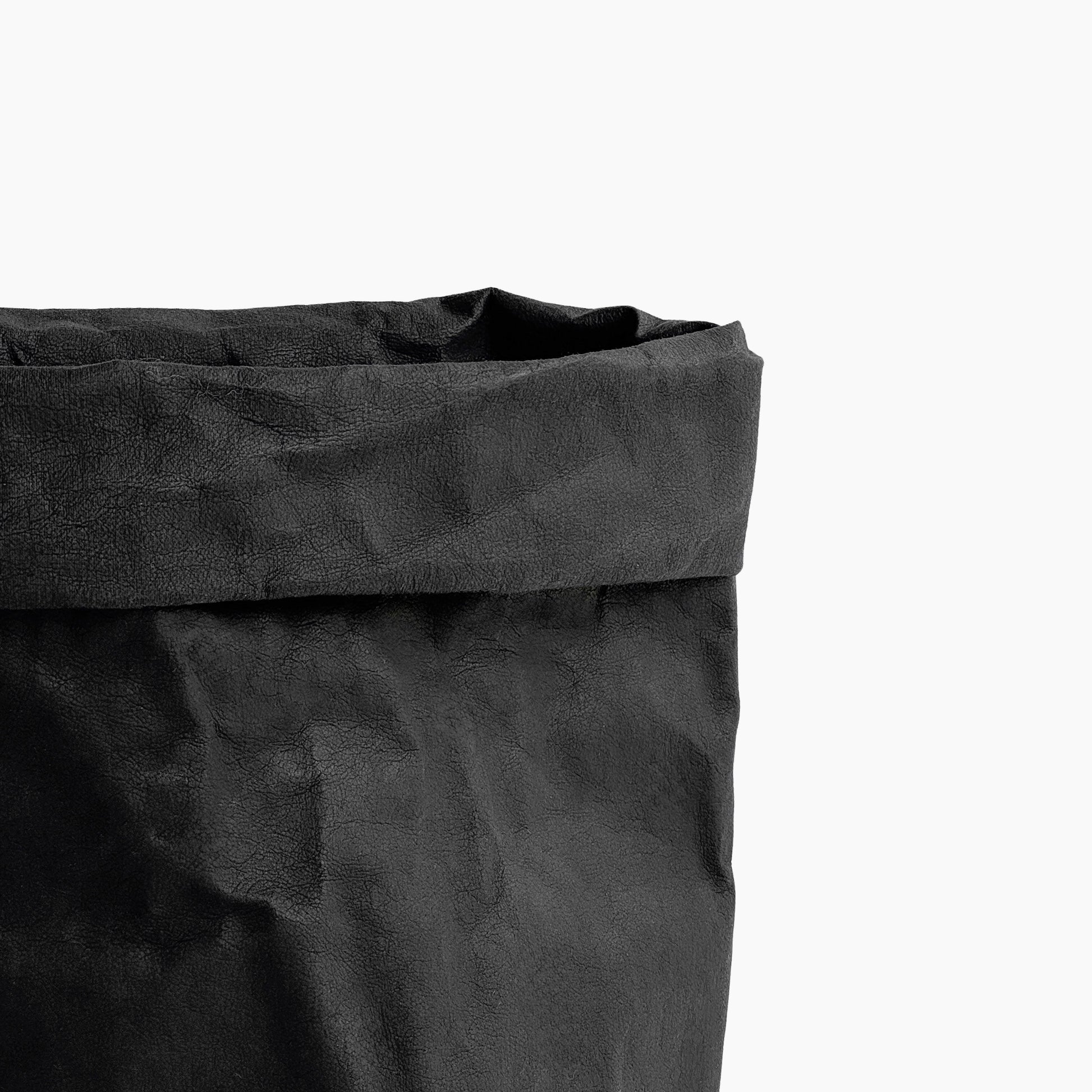 Close-up of a black washable paper bag on a white background