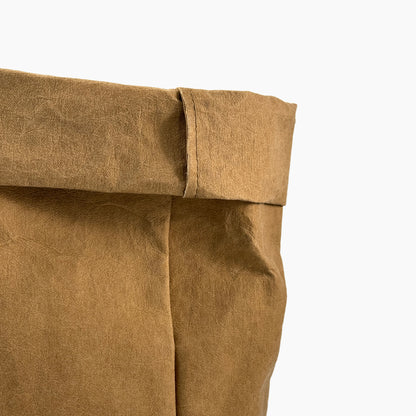 Close-up of a brown washable paper bag on a white background