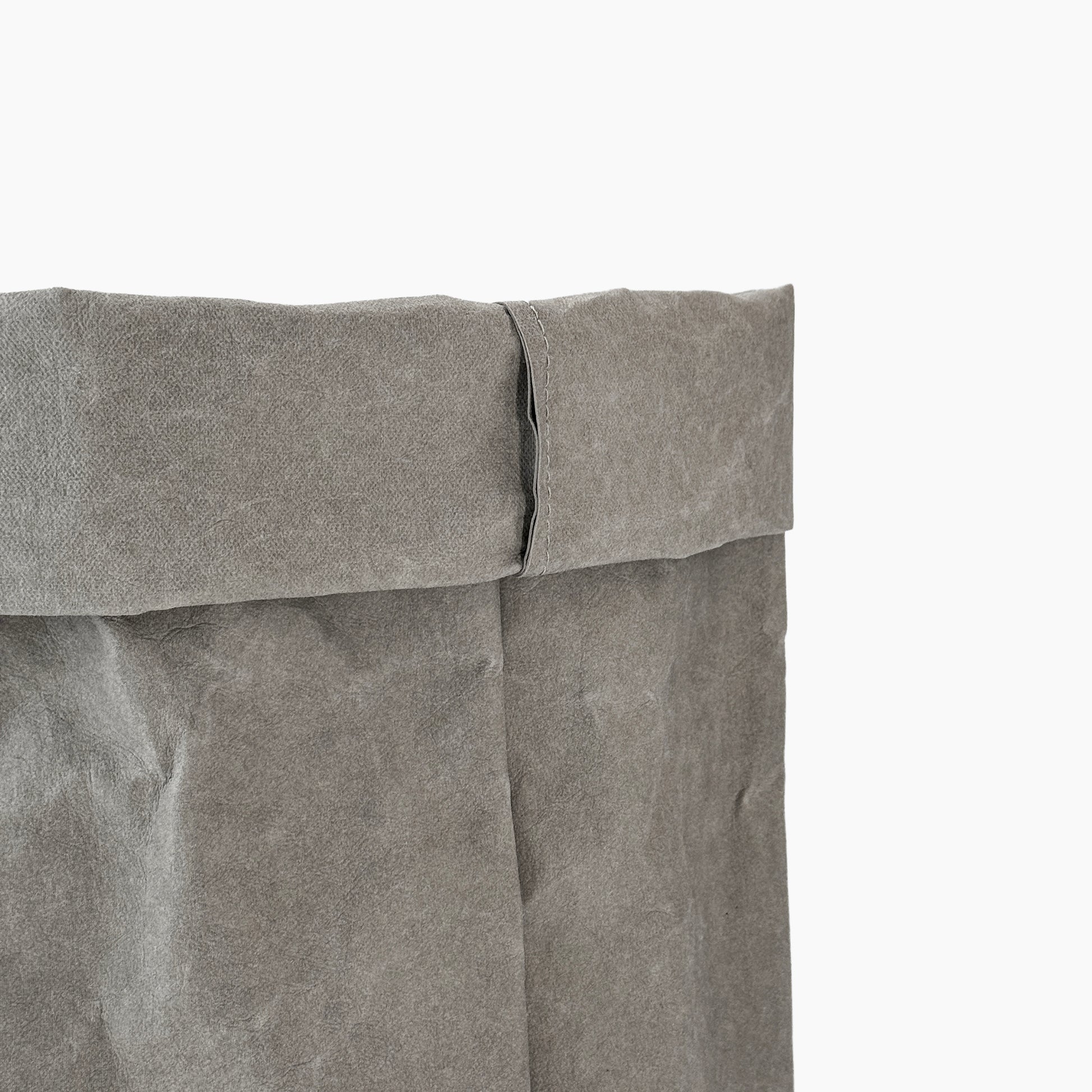 Close-up of a gray washable paper bag with a white background