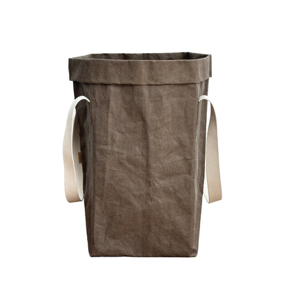 Cocoa brown washable paper laundry basket, natural cotton straps, white backdrop, eco storage