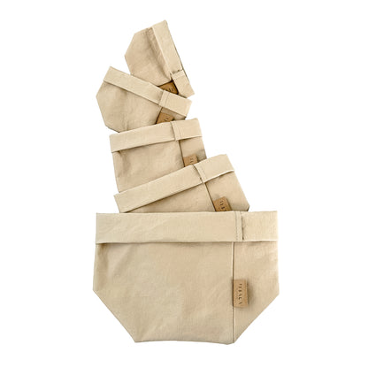 Sand beige washable paper bags presented on a white background