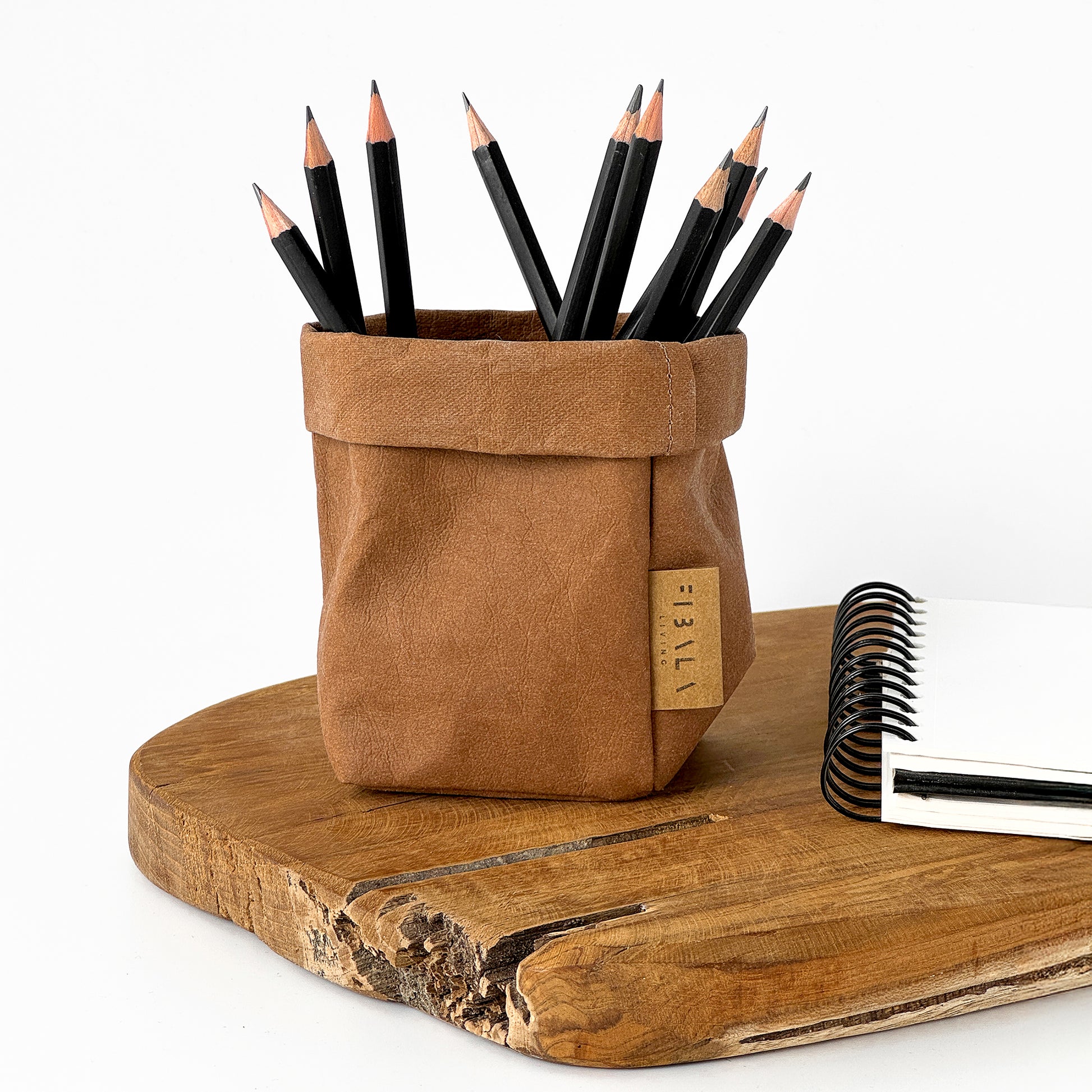 XS Tall Cinnamon Brown Washable Paper pencil holder with pencils on a wooden surface