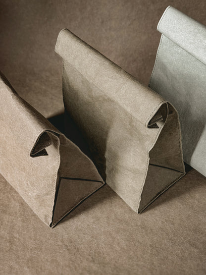 Close view of washable paper lunch bags with the top rolled down