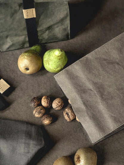 Washable paper lunch bag with pears and walnuts, a second bag with elastic band behind it