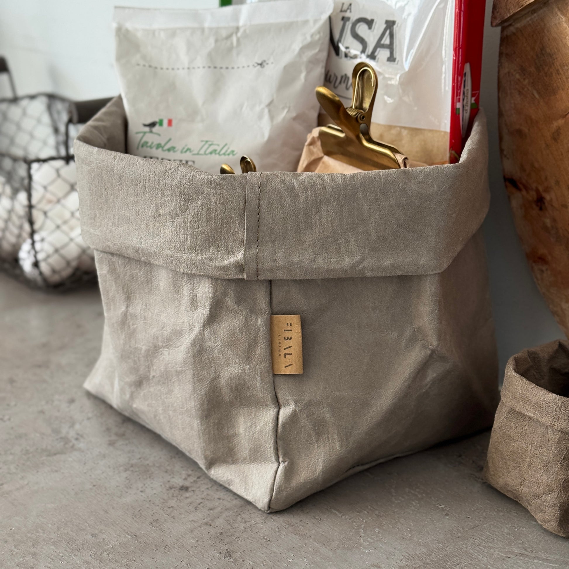 Chino washable paper bag with a label on a concrete kitchen counter