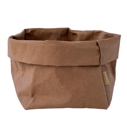 Cinnamon brown washable paper bag with a visible brand label on a white background