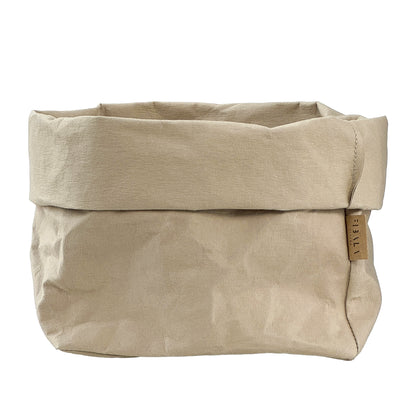 Sand beige washable paper bag with a visible brand tag on a white background