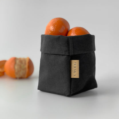 Petite black washable paper fruit bag with oranges, light gray BG—eco reusable tote