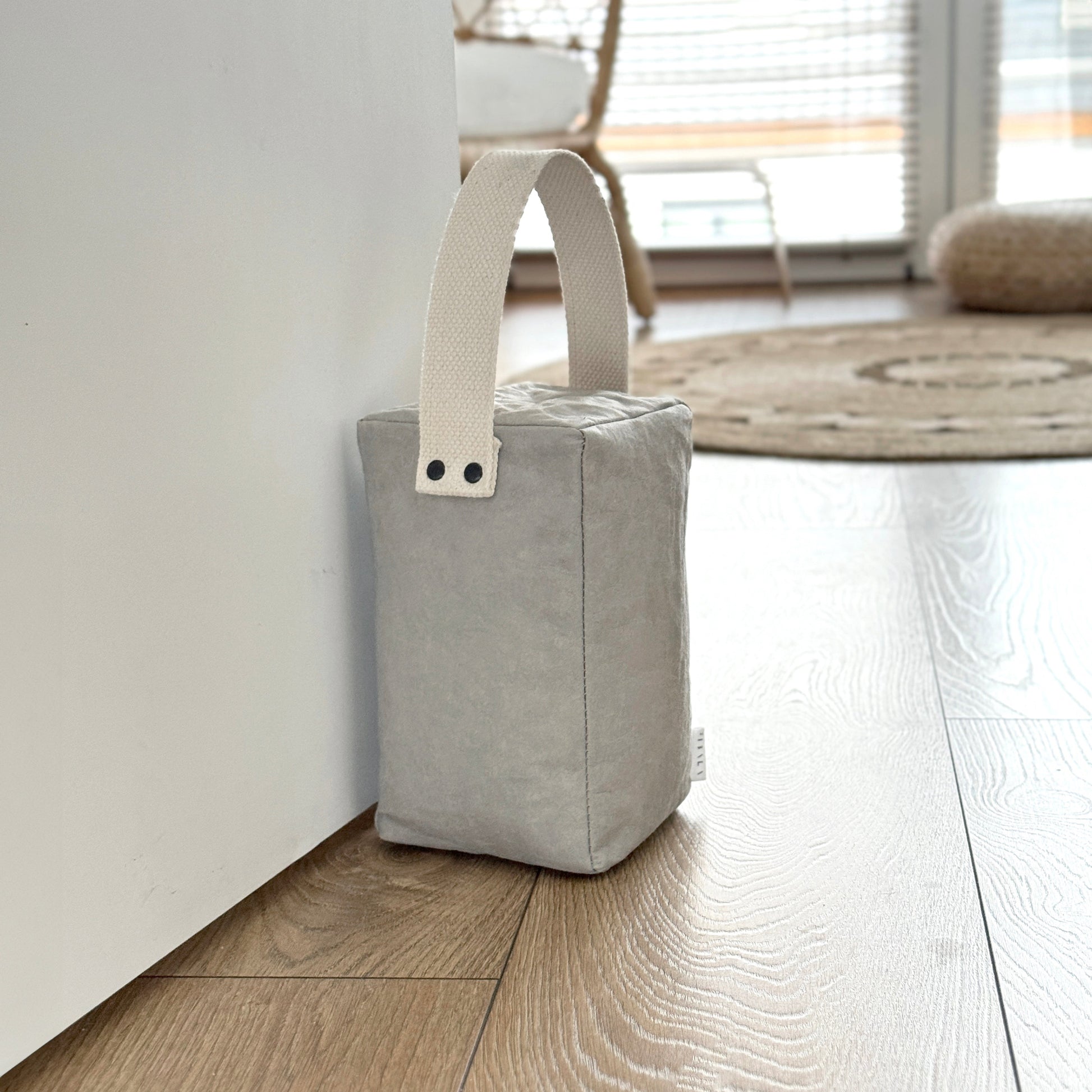 Portico washable paper door stop in modern minimalist interior
