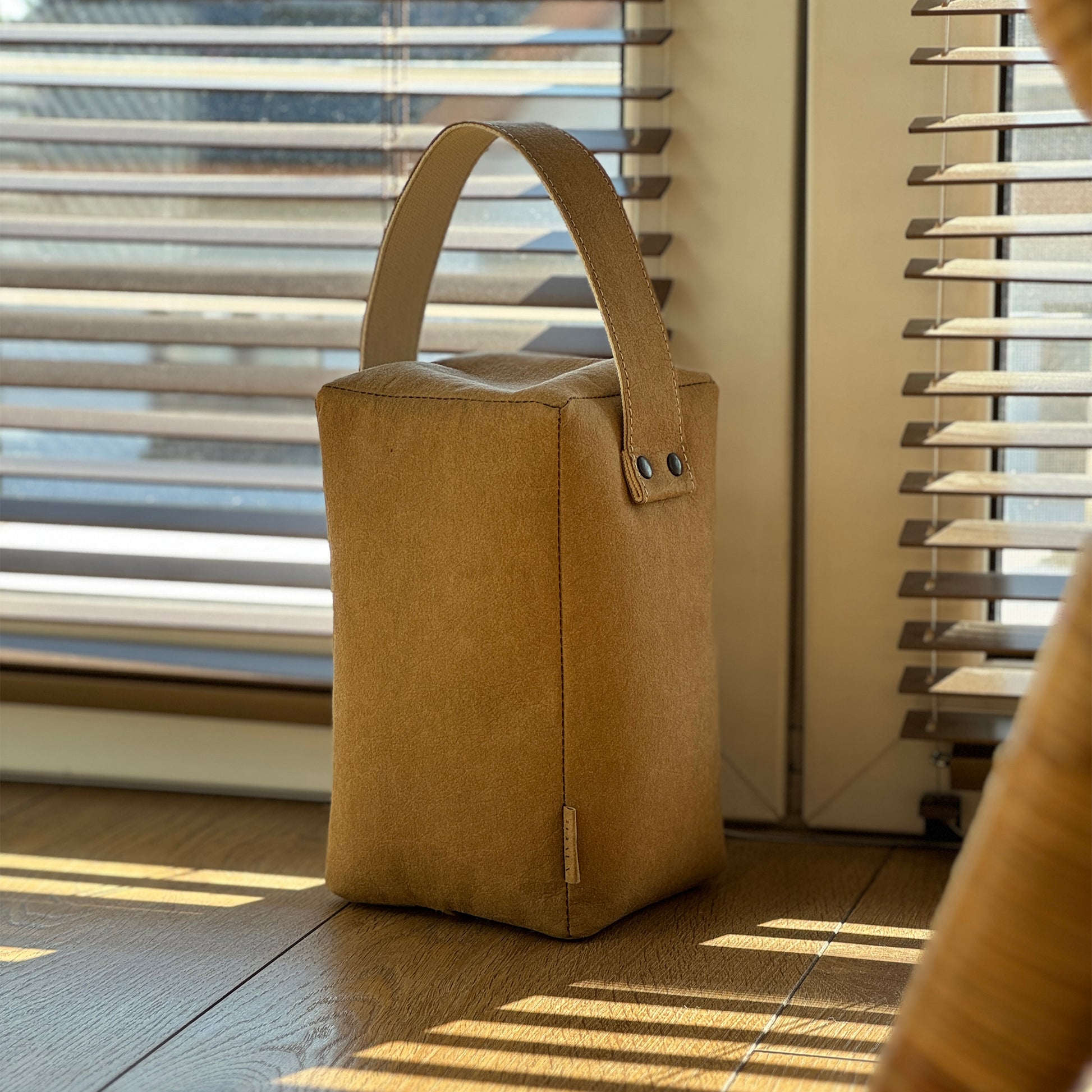 Brown Cube washable paper doorstop, matching handle, black rivets, wood-floor-safe eco chic